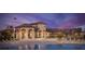 Resort-style pool and clubhouse with lounge chairs at 1411 Clubman Dr, Davenport, FL 33896