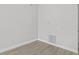 Empty bedroom with wood-look floors and neutral walls at 656 Koala Ct, Kissimmee, FL 34759