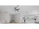 Modern kitchen with white cabinets, an island, and stainless steel appliances at 656 Koala Ct, Kissimmee, FL 34759