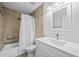 Clean bathroom with white vanity, quartz countertop and shower/tub combo at 656 Koala Ct, Kissimmee, FL 34759