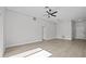 Spacious living room featuring light walls and wood-look floors at 656 Koala Ct, Kissimmee, FL 34759