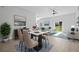 Open concept dining area with a modern dining table and chairs at 656 Koala Ct, Kissimmee, FL 34759