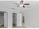 Bright bedroom with double doors to bathroom and walk in closet at 656 Koala Ct, Kissimmee, FL 34759