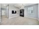 Dining room with tile floors, accent wall, and flat-screen TV at 7642 Fairgrove Ave, Windermere, FL 34786