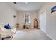 Bright bedroom with a built-in desk, comfortable armchair and spacious closet at 511 Pineloch Dr, Haines City, FL 33844