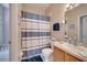 Clean bathroom with a shower/tub combo and updated vanity at 511 Pineloch Dr, Haines City, FL 33844