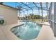 Inviting screened pool and spa with patio seating at 511 Pineloch Dr, Haines City, FL 33844