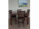 Dining area with a dark wood table and chairs at 511 Pineloch Dr, Haines City, FL 33844