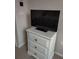 Bedroom with dresser and TV at 511 Pineloch Dr, Haines City, FL 33844
