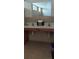 Double vanity bathroom with neutral tile floors at 511 Pineloch Dr, Haines City, FL 33844