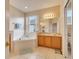 Relaxing bathroom featuring a large soaking tub and double vanity at 511 Pineloch Dr, Haines City, FL 33844
