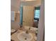 Bathroom with a vanity, mirror, and white sink at 511 Pineloch Dr, Haines City, FL 33844