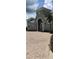Gray two-story home with a grand entrance and paved driveway at 511 Pineloch Dr, Haines City, FL 33844
