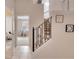 Elegant staircase with wrought iron railing and neutral wall colors at 511 Pineloch Dr, Haines City, FL 33844
