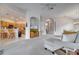 Open living room with kitchen views, neutral colors, and cozy seating at 511 Pineloch Dr, Haines City, FL 33844