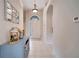 Bright and airy entryway with decorative console table at 511 Pineloch Dr, Haines City, FL 33844