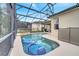 Refreshing pool with a screened patio and inflatable floats at 511 Pineloch Dr, Haines City, FL 33844