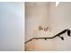 Modern staircase with a simple railing and a small landing area at 511 Pineloch Dr, Haines City, FL 33844