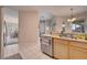 Open kitchen with stainless steel appliances and breakfast bar at 511 Pineloch Dr, Haines City, FL 33844