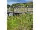 Wooden dock with birds perched on railing, overlooking lake at 511 Pineloch Dr, Haines City, FL 33844