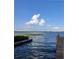Serene waterfront view with calm waters and distant shore at 511 Pineloch Dr, Haines City, FL 33844