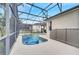 Inviting screened pool and spa with inflatable toys at 511 Pineloch Dr, Haines City, FL 33844