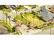 Gated community entrance with palm trees and landscaping at 511 Pineloch Dr, Haines City, FL 33844