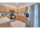 Modern kitchen with stainless steel appliances and ample counter space at 511 Pineloch Dr, Haines City, FL 33844