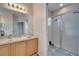 Clean bathroom with a shower, single vanity, and plenty of counter space at 511 Pineloch Dr, Haines City, FL 33844