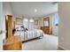 Comfortable guest bedroom with a queen-size bed and wood dresser at 511 Pineloch Dr, Haines City, FL 33844
