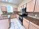 Kitchen with granite countertops and stainless steel appliances at 122 Stone Gable Cir, Winter Springs, FL 32708