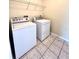 Bright laundry room with washer and dryer included at 122 Stone Gable Cir, Winter Springs, FL 32708