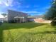 Large backyard with a pergola and spacious grassy area at 122 Stone Gable Cir, Winter Springs, FL 32708