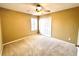 Well-lit bedroom featuring carpet and window with blinds at 122 Stone Gable Cir, Winter Springs, FL 32708