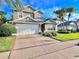 Two-story house with a white garage door and manicured lawn at 122 Stone Gable Cir, Winter Springs, FL 32708