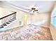 Spacious living room featuring tile floors and elegant staircase at 122 Stone Gable Cir, Winter Springs, FL 32708