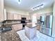 Spacious kitchen with stainless steel appliances and granite countertops at 122 Stone Gable Cir, Winter Springs, FL 32708