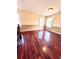 Sunlit bonus room offering hardwood floors and window at 122 Stone Gable Cir, Winter Springs, FL 32708