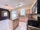 Kitchen features island, granite counters, and stainless steel appliances at 122 Stone Gable Cir, Winter Springs, FL 32708