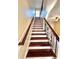 Elegant staircase with wrought iron railing and hardwood steps at 122 Stone Gable Cir, Winter Springs, FL 32708