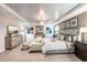 Main bedroom suite with king-size bed and sitting area at 2424 Park Ridge St, Apopka, FL 32712