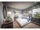 Spacious bedroom with a large bed, nightstands, and decor at 2424 Park Ridge St, Apopka, FL 32712