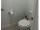 Powder room with a toilet and neutral color palette at 2021 Crape Jasmine Ln, Orlando, FL 32824