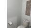 Small bathroom with toilet and decorative wall art at 2021 Crape Jasmine Ln, Orlando, FL 32824