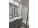 Double vanity bathroom with a large walk-in shower at 2021 Crape Jasmine Ln, Orlando, FL 32824