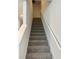 Carpeted staircase leading to the second floor at 2021 Crape Jasmine Ln, Orlando, FL 32824