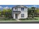 Two-story house with gray siding, landscaping, and a walkway at 2432 Cedar Rose St, Apopka, FL 32712