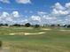 Golf carts travel along the scenic golf course at 7762 Linkside Loop, Reunion, FL 34747