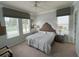 Spacious bedroom with king-size bed and ample natural light at 7762 Linkside Loop, Reunion, FL 34747