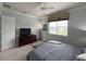 Bedroom with a queen bed and window view at 7762 Linkside Loop, Reunion, FL 34747